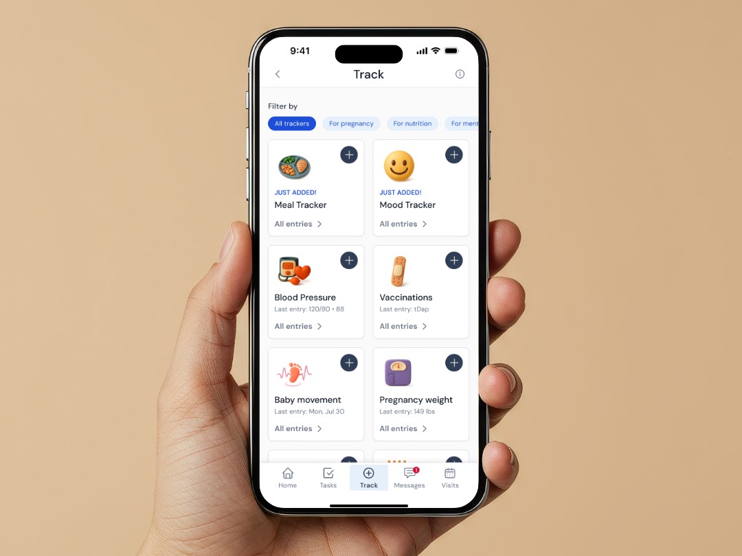 Someone tracking pregnancy care in the Wildflower app on a phone